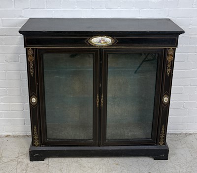 Lot 876 - A 19TH CENTURY FRENCH EBONISED BOOKCASE WITH PORCELAIN PLAQUES