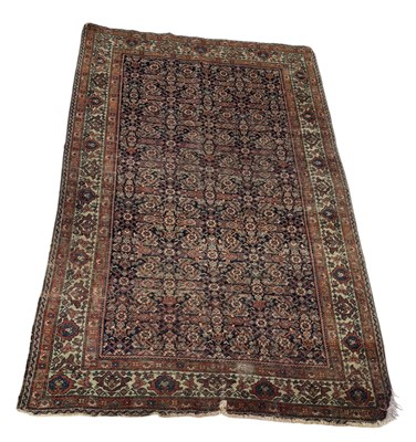 Lot 902 - AN ANTIQUE PERSIAN CARPET