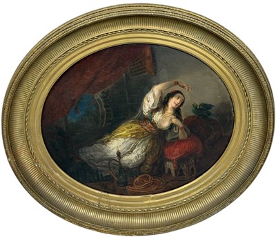 Lot 553 - A 19TH CENTURY FRENCH ORIENTALIST OIL PAINTING ON PANEL DEPICTING AN ODALIQUE IN AN INTERIOR PLAYING WITH HER PET PARROT