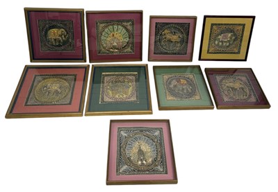 Lot 737 - A GROUP OF NINE INDIAN EMBROIDERED PANELS DECORATED WITH ANIMALS TO INCLUDE PEACOCKS AND ELEPHANTS