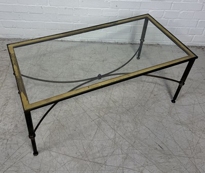 Lot 945 - HOLLYWOOD REGENCY: A BRASS AND GLASS COFFEE TABLE