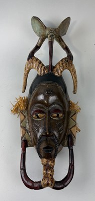 Lot 395 - AN AFRICAN PAINTED MASK