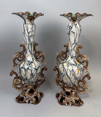 Lot 297 - WILHELM SCHILLER & SOHN, BOHEMIA: A PAIR OF LATE 19TH CENTURY TALL VASES DECORATED IN FAUX MARBLE GLAZES WITH ORNATE SCROLLED APPENDAGES