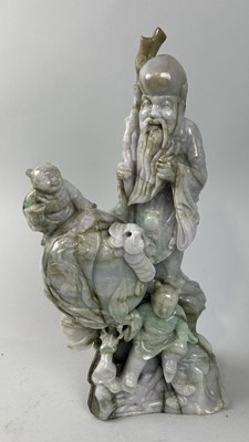 Lot 236 - A CHINESE JADE FIGURE OF SHAOLIN WITH TWO BOYS