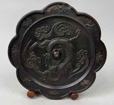 Lot 166 - A CHINESE BRONZE DRAGON MIRROR