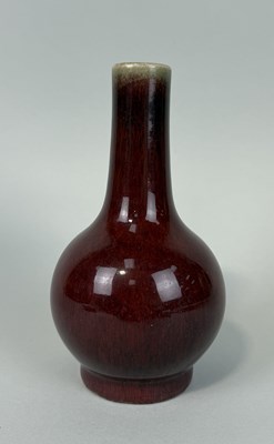 Lot 186 - A CHINESE SANG DE BOEUF BOTTLE VASE