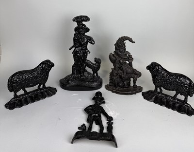 Lot 821 - A COLLECTION OF ANTIQUE CAST IRON DOOR STOPS TO INCLUDE PUNCH