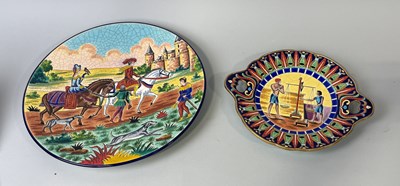 Lot 380 - A CHRISTIAN LECERCQ FOR LONGWY FAIENCE DISH, 'RETOUR DE CHASSE' AND A LONGWY TWO HANDLED PLATE, 'SCENE DE PASAGE EN ENEGYPTE'.