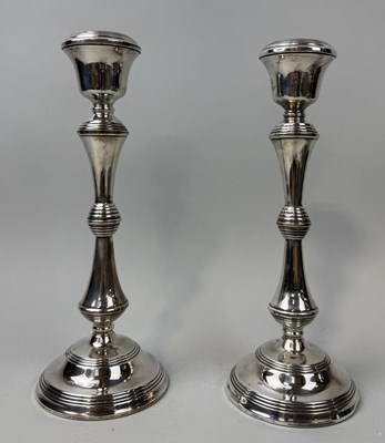 Lot 194 - A PAIR OF SILVER CANDLESTICKS