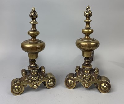 Lot 400 - A PAIR OF 19TH CENTURY BRASS FIRE DOGS WITH MASKS