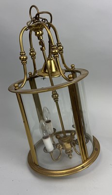 Lot 798 - A BRASS HANGING LANTERN WITH GLASS PANELS