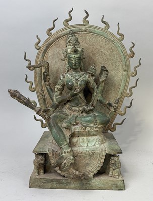 Lot 73 - A HEAVY BRONZE TARA ON DOUBLE LOTUS THRONE FRAMED BY A FLAMING AUREOLE