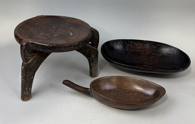 Lot 130 - AN AFRICAN HARD WOOD THREE LEG MILKING STOOL ALONG WITH TWO WOODEN DISHES