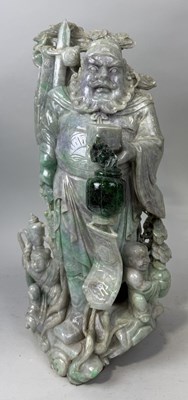 Lot 149 - A CHINESE JADE OR JADEITE CARVING POSSIBLY DEPICTING THE GOD OF WEALTH