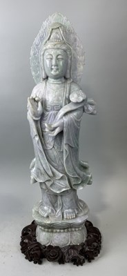 Lot 152 - A VERY LARGE CHINESE JADE OR JADEITE FIGURE OF THE GUANYIN HOLDING A RUYI SCEPTRE