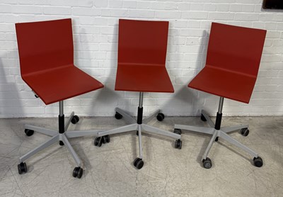 Lot 776 - A GROUP OF THREE RED EAMES 'VITRA' SWIVEL CHAIRS