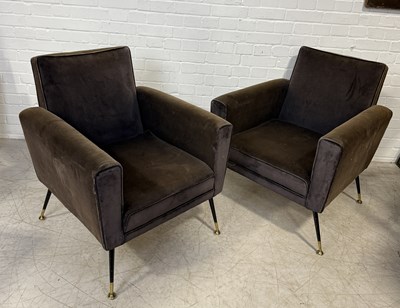 Lot 772 - A PAIR OF BROWN ARMCHAIRS WITH METAL LEGS