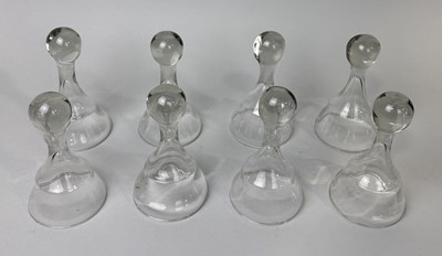 Lot 889 - A SET OF EIGHT GLASS STIRRUP CUPS