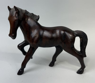 Lot 424 - A CARVED WOODEN SCULPTURE OF A HORSE