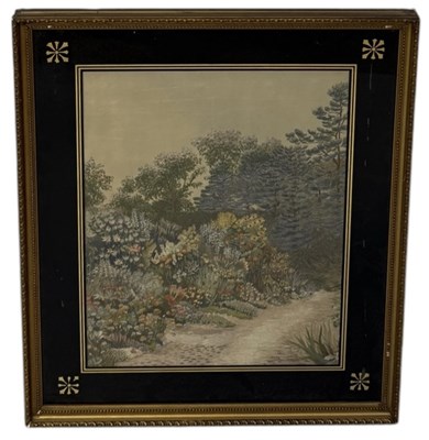 Lot 716 - A NEEDLEPOINT EMBROIDERY DEPICTING A GARDEN WITH FLOWERS