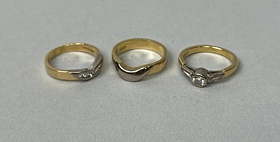 Lot 322 - AN 18T GOLD TRILOGY OF RINGS , TWO WITH DIAMONDS