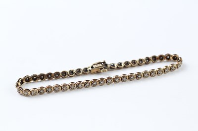 Lot 87 - A 9CT GOLD AND DIAMOND BRACELET