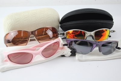 Lot 1162 - A COLLECTION OF DESIGNER OAKLEY SUNGLASSES INCLUDING CASES (4)