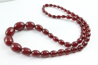 Lot 848 - A GRADUATED CHERRY BAKELITE BEADED NECKLACE