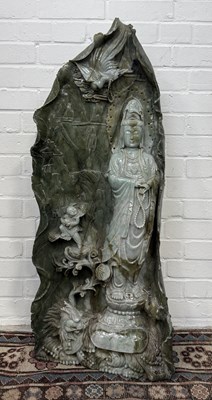 Lot 147 - A VERY LARGE CHINESE JADE OR JADEITE FIGURE OF A GUANYIN