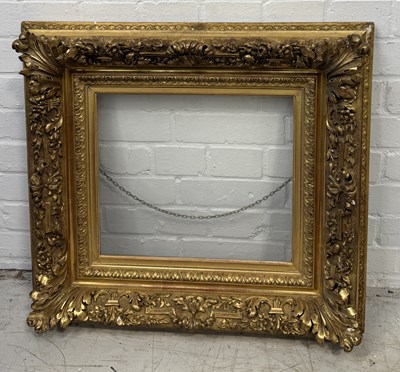 Lot 839 - A HEAVY ANTIQUE CARVED WOOD GILDED PICTURE FRAME