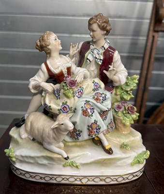 Lot 868A - A PORCELAIN GROUP DEPICTING A LADY AND GENTLEMAN WITH A LAMB