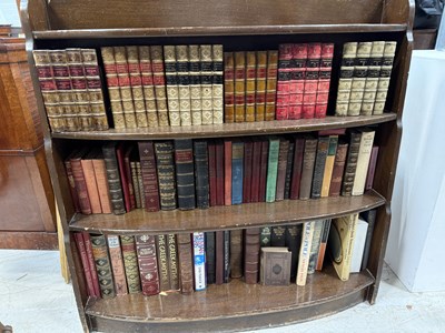 Lot 881 - A BOOKCASE WITH FAUX BOOKS AND REAL BOOKS