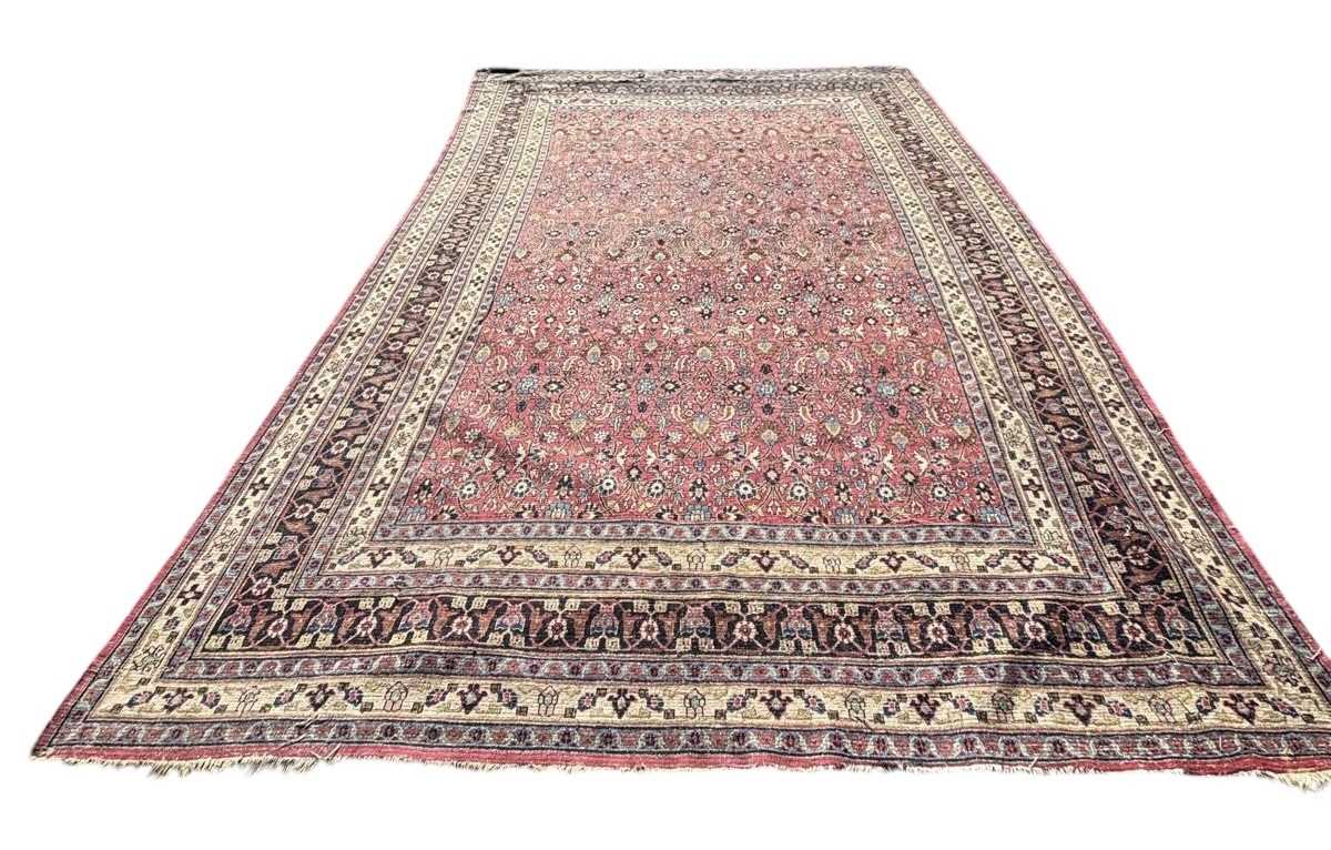 Lot 922 - A LARGE RED PERSIAN DESIGN CARPET