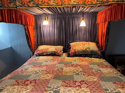 Lot 865 - AN ANTIQUE AND LATER FOUR POSTER BED WITH LIBERTY AND CO FABRIC