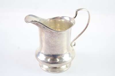 Lot 406 - A .925 STERLING SILVER CREAM JUG