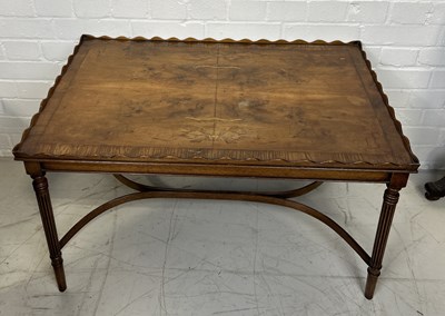 Lot 1099 - A WOODEN COFFEE TABLE WITH WAVE CUT EDGES