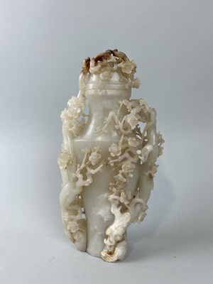 Lot 599B - A CHINESE JADE VASE AND COVER DECORATED WITH BLOSSOM BRANCHES AND FLOWERS