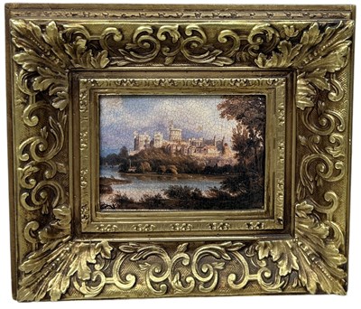 Lot 872 - AN OIL PAINTING ON BOARD DEPICTING A TOPOGRAPHICAL CASTLE SCENE BY A LAKE