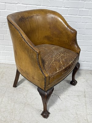 Lot 776 - AN ANTIQUE LEATHER TUB CHAIR RAISED ON CARVED ACANTHUS CABRIOLE LEGS, ON CLAW AND BALL FEET