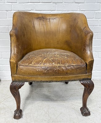 Lot 776 - AN ANTIQUE LEATHER TUB CHAIR RAISED ON CARVED ACANTHUS CABRIOLE LEGS, ON CLAW AND BALL FEET