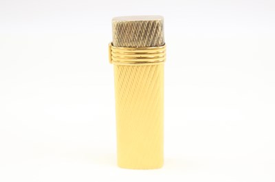 Lot 1207 - A CHRISTIAN DIOR PARIS GOLD PLATED POCKET LIGHTER SWISS MADE GUILLOCHE DESIGN