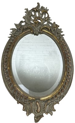 Lot 1062 - A ROCOCCO GILDED WALL MIRROR