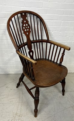 Lot 1132 - AN ASH AND ELM WINDSOR ARMCHAIR STAMPED 'F.W'