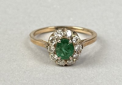 Lot 420 - A 9CT GOLD EMERALD AND DIAMOND CLUSTER RING