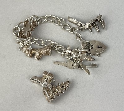 Lot 321 - A SILVER CHARM BRACELET