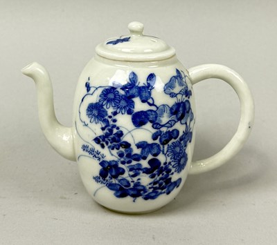 Lot 660 - A JAPANESE PORCELAIN TEA POT, BLUE AND WHITE PAINTED WITH FLOWERS