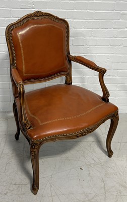 Lot 1102 - A FRENCH FAUTEUIL UPHOLSTERED IN TOOLED TAN BUTTON BACK LEATHER