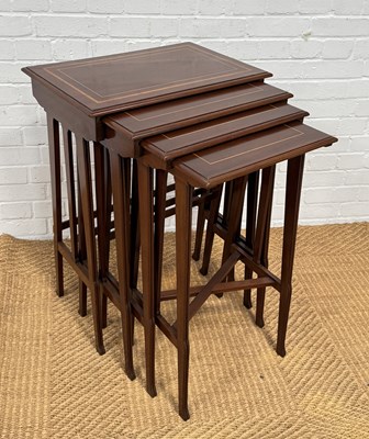 Lot 1059 - A CROSS BANDED MAHOGANY NEST OF FOUR TABLES