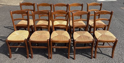 Lot 1114 - A SET OF TEN LADDER BACK CHAIRS WITH RUSH SEAT