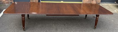 Lot 970 - A WILLIAM IV FOUR LEAF WIND OUT DINING TABLE WITH FLUTED LEGS ON CASTORS